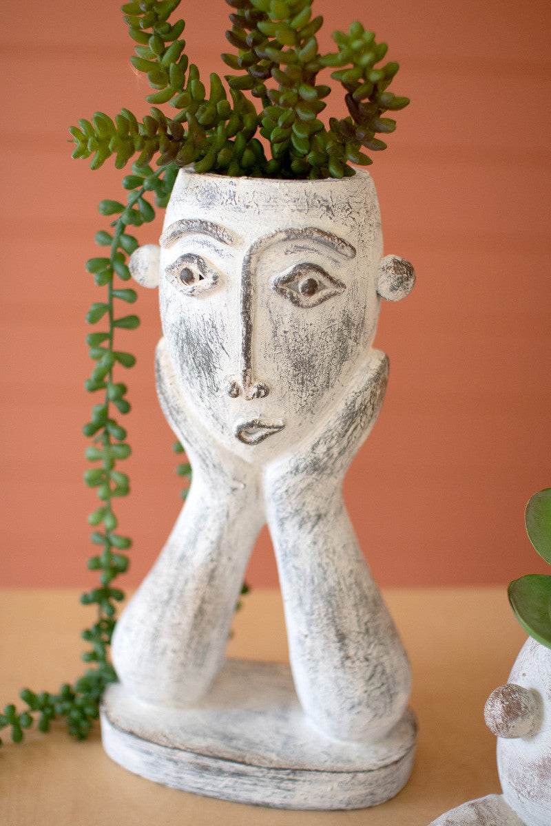 SET OF TWO PAINTED RESIN FACE PLANTERS