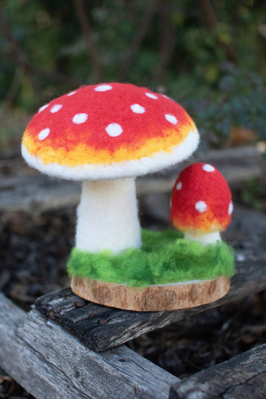 FELT MUSHROOMS ON A WOODEN BASE