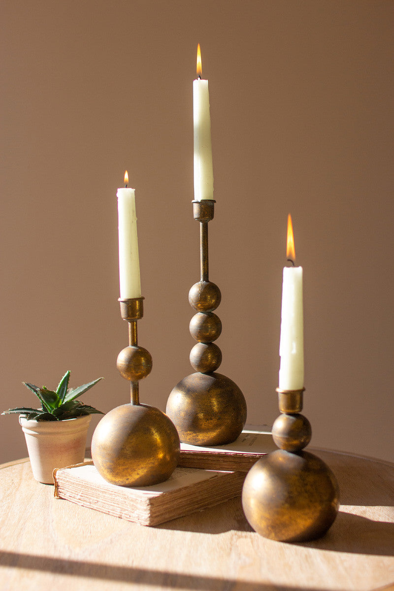 SET OF THREE ANTIQUE BRASS TAPER CANDLE HOLDERS