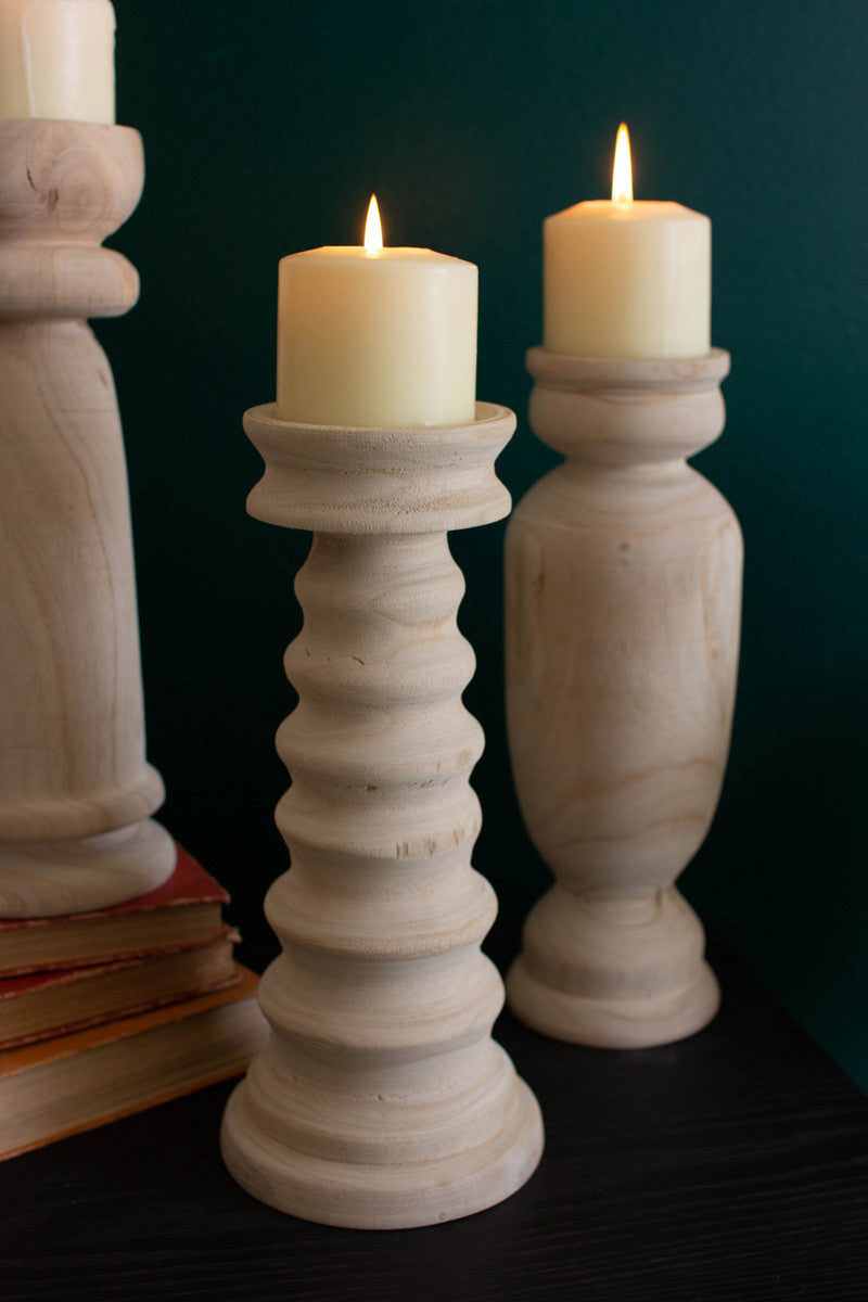 SET OF THREE TURNED WOODEN CANDLE HOLDERS