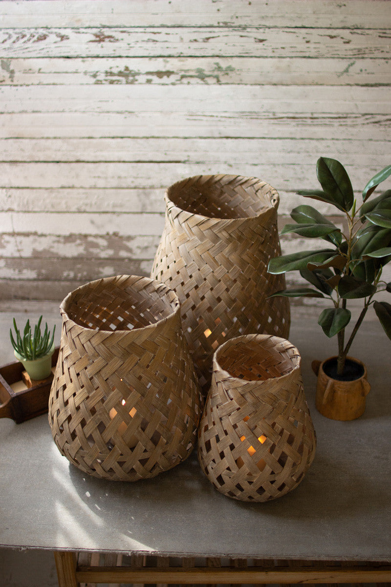 SET OF THREE WOVEN BAMBOO LANTERNS WITH GLASS