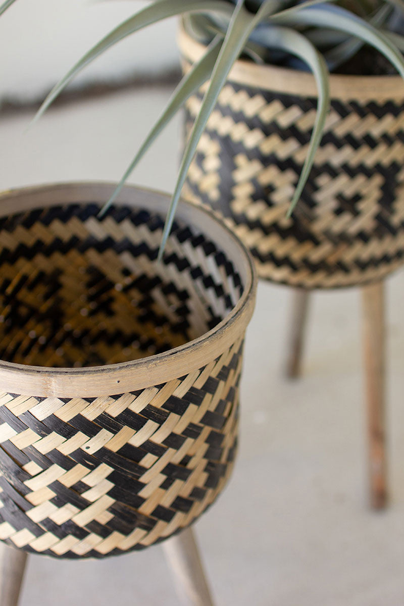 SET OF TWO WOVEN BLK & NAT BAMBOO PLANT STANDS W WOOD LEGS