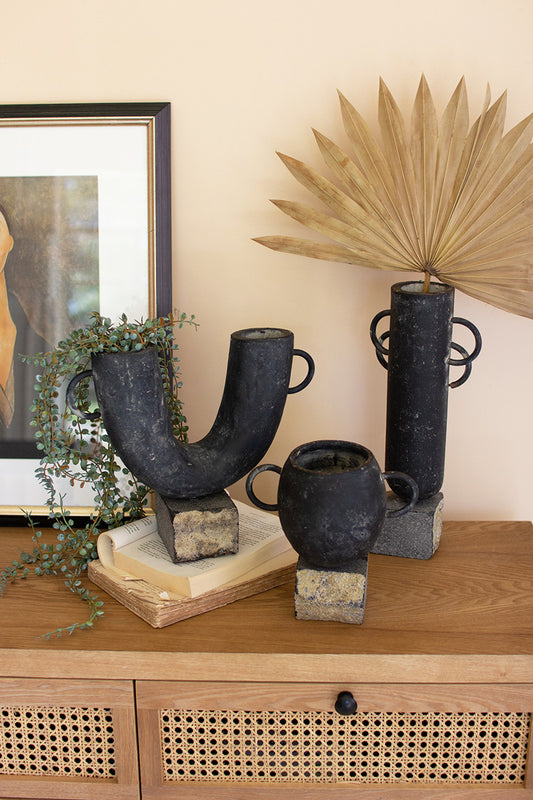 SET OF THREE BLACK MODERN CLAY VASES ON ROCK BASES