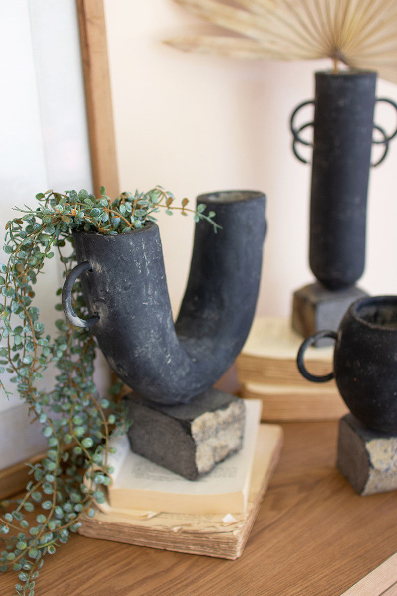 SET OF THREE BLACK MODERN CLAY VASES ON ROCK BASES