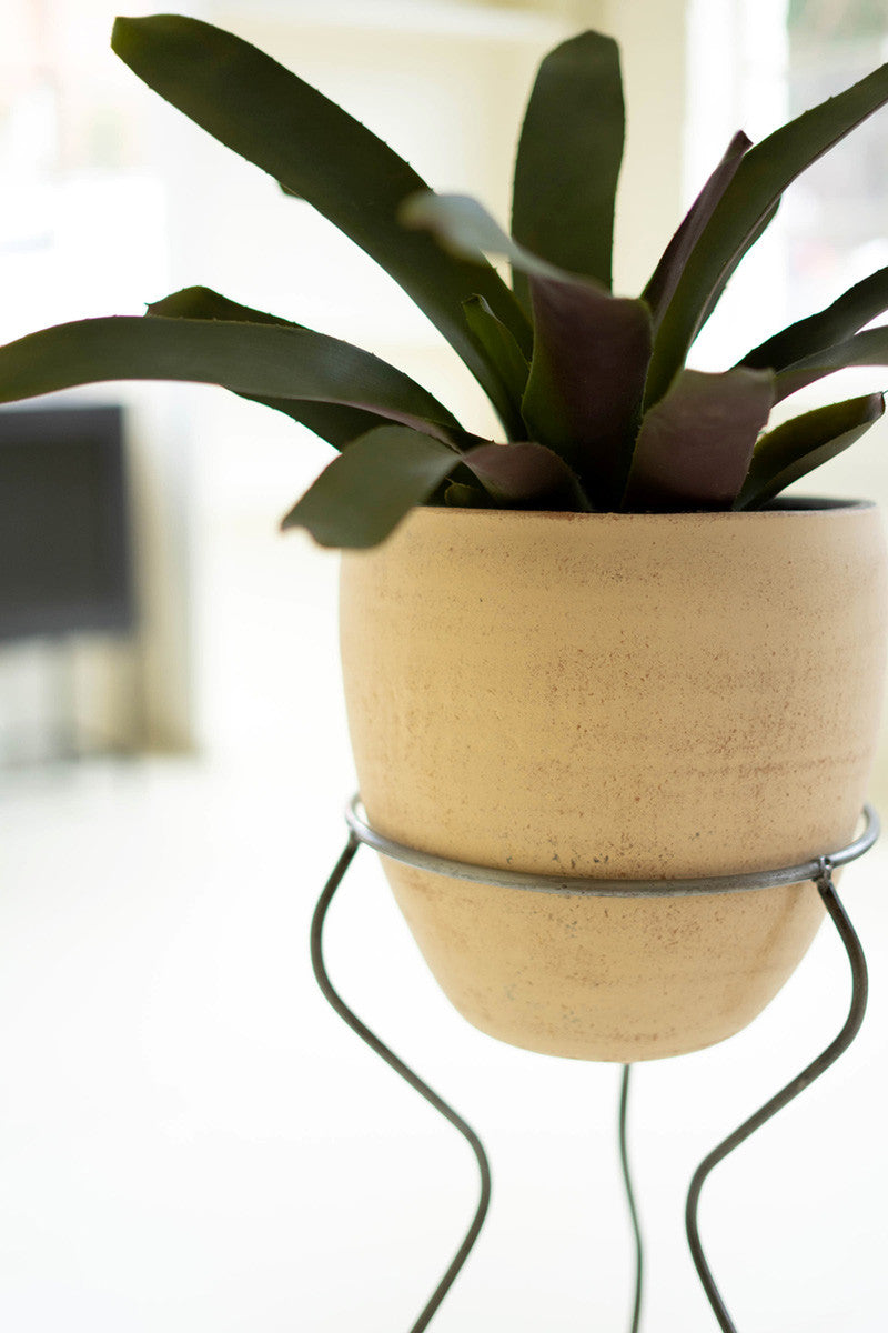 IVORY AND BLACK CLAY POT WITH WIRE SQUIGGLE BASE