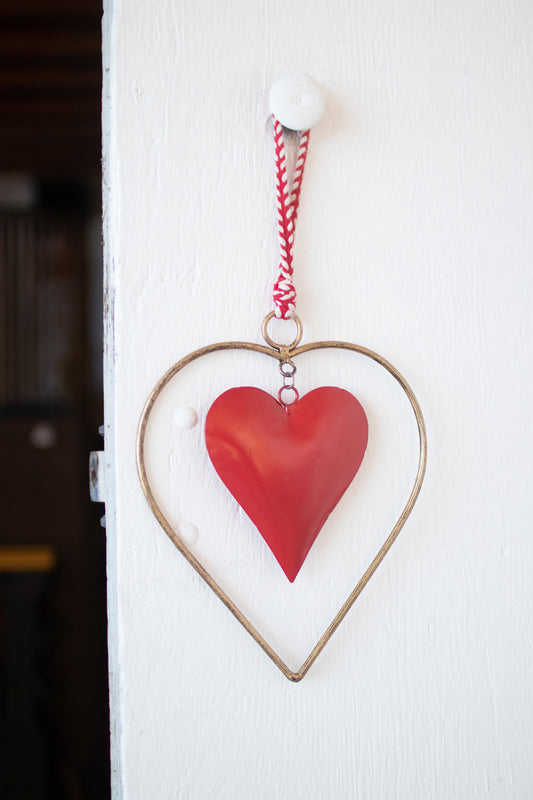 ANTIQUE BRASS AND RED HEART DOOR HANGER