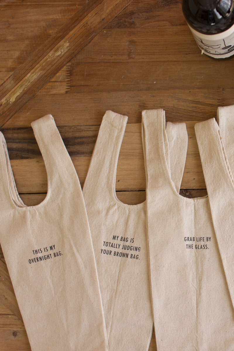 SET OF SIX WINE BAGS WITH QUIRKY SAYINGS